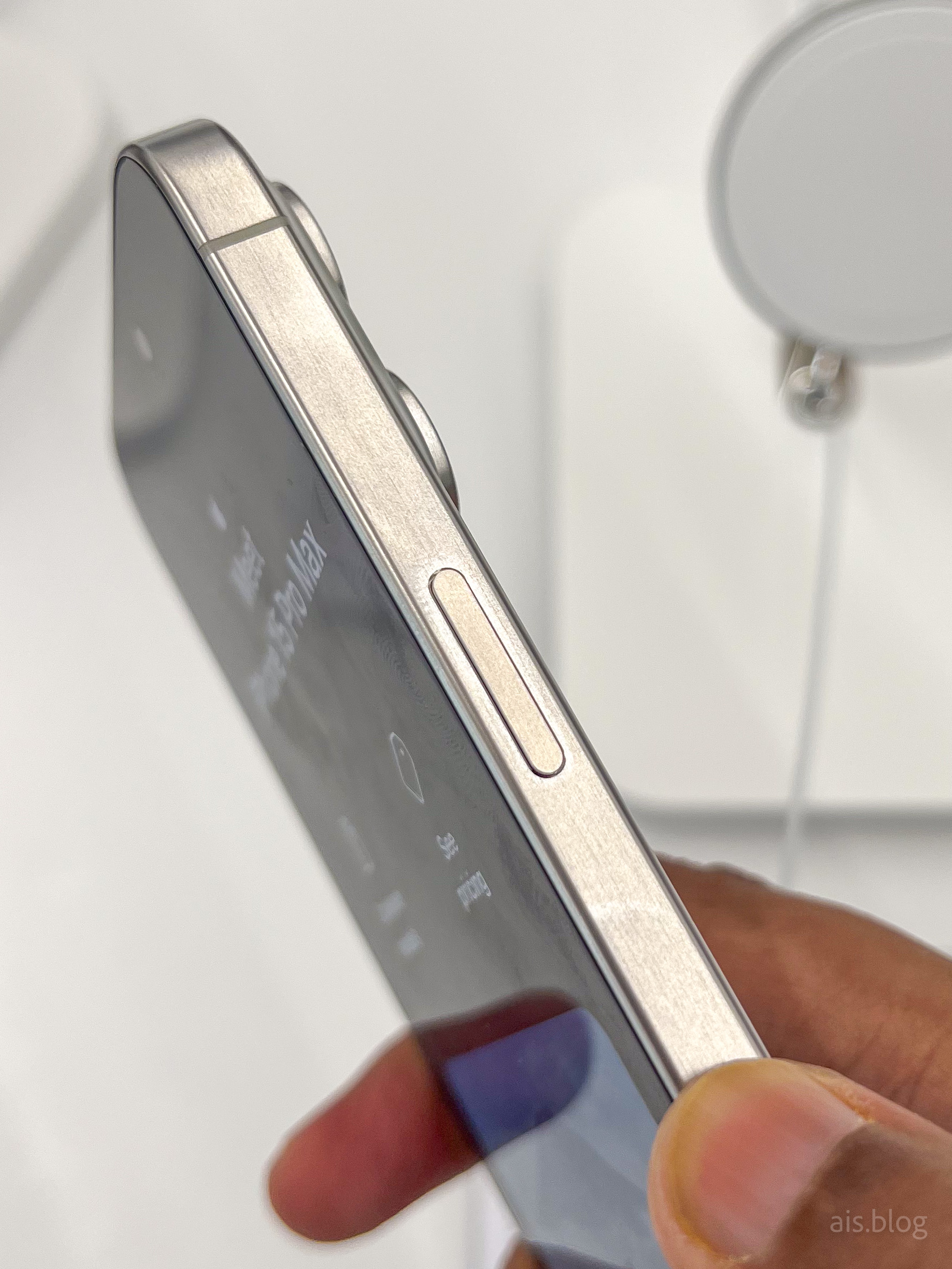 iphone 15 pro max all colors hands on. fingerprint visible.
